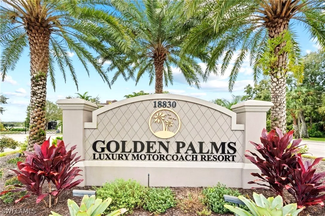 A sign that says golden palms luxury motorcoach resort.