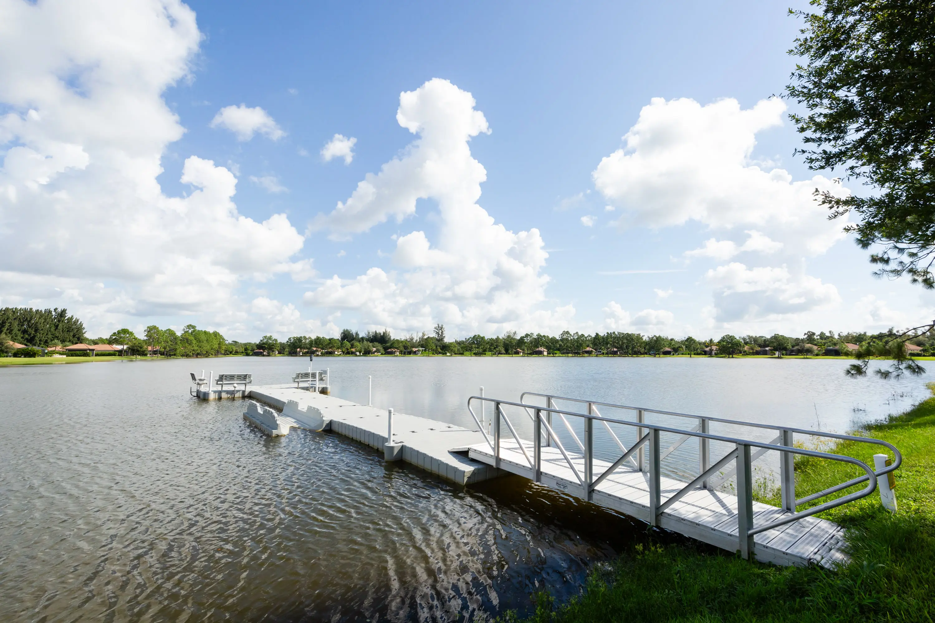 A dock with a pier in the middle of a lake.